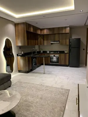 a kitchen with a table and a refrigerator at Chic Studio Near Beach & Cafés in Casablanca