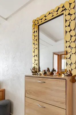 a mirror on top of a dresser in a room at Elegant Apartment with Pool & Moroccan Lounge in Bouznika