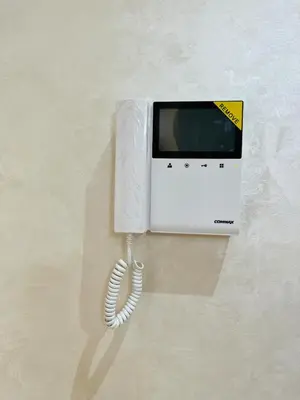 a white microwave with a cord plugged into it at Studio 1 Min Beach - Pool - Air conditioning - Fiber in Mohammedia