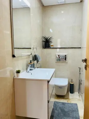 a bathroom with a sink and a toilet at Studio 1 Min Beach - Pool - Air conditioning - Fiber in Mohammedia