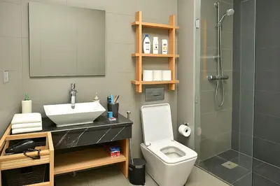 a bathroom with a sink and a toilet and a shower at Lux apartment, wifi, Netflix, parking in Casablanca