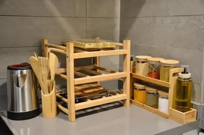 a kitchen counter with a wooden shelf with food and utensils at Lux apartment, wifi, Netflix, parking in Casablanca