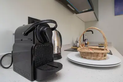 a tea kettle and a basket on a counter at Elegant Studio - Quiet & Stylish in Casablanca
