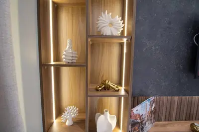 a wooden shelf with vases and other items on it at Elegant Studio - Quiet & Stylish in Casablanca