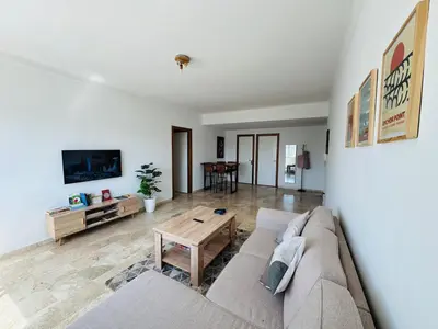 a living room with a couch and a table at Atlantica in Rabat