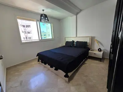 a bedroom with a bed and a window at Ideal apartment for business trips in Casablanca