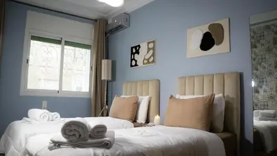 a bedroom with two beds with towels on them at Yaqcha Home in Casablanca