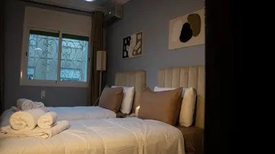 a bedroom with two beds with towels on them at Yaqcha Home in Casablanca