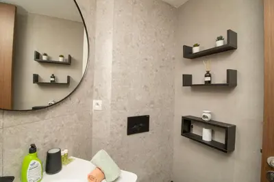 a bathroom with a mirror and a sink at Elegant Studio in Maarif - Gym access & Free Parking & Wifi Fiber in Casablanca