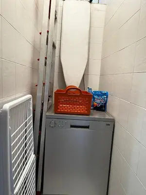a washing machine with an orange basket on top of it at Lalla Mina Suite with large Terrace - Dar EL BAHIA in Casablanca