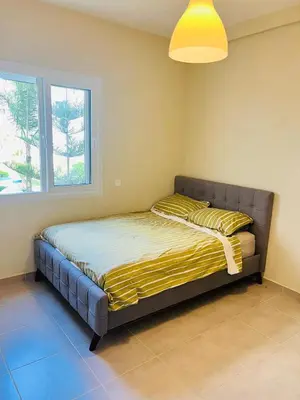 a large bed in a room with a window at Fal azure in Bouznika