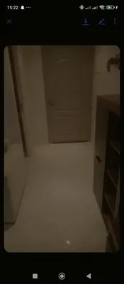 a room with a white floor and a door at Aicha Iliana in Bouznika