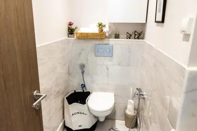 a bathroom with a toilet and a sink at VIVASTAY Casablanca - Charming Studio Nouacer - 4 min Airport Mohamed V CMN in Nouaseur