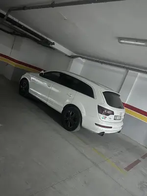 a white car parked in a parking garage at chic & cozy Apartment, Parc Serenity in Mohammedia