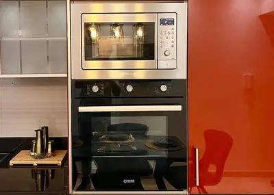 a microwave above a stove in a kitchen at Chic, well-equipped apartment in a perfect location in Temara