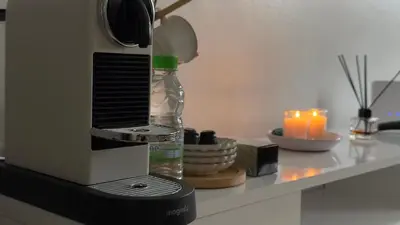 a coffee machine sitting on a counter with a candle at Charming City Retreat in Agdal - Walk to Train Station in Rabat