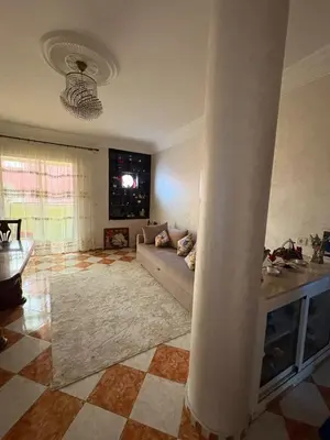 a living room with a couch and a column at Summer sale two bedroom APT Near downtown in Casablanca