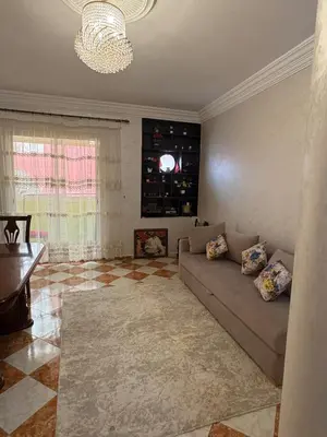 a living room with a couch and a fireplace at Summer sale two bedroom APT Near downtown in Casablanca