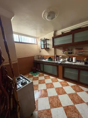 a kitchen with a stove and a checkered floor at Summer sale two bedroom APT Near downtown in Casablanca