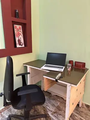 a desk with a laptop computer on top of it at Appartment calme a Ain Aouda in Aïn el Apuda