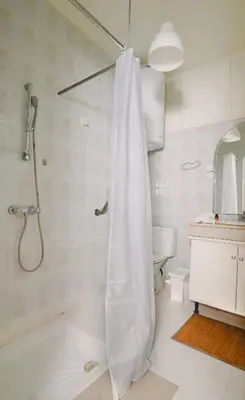 a bathroom with a shower with a shower curtain at Casa Nova Maison moderne à deux pas de la plage in Bouznika