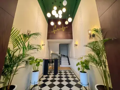a hallway with potted plants and a staircase at Maya Suites - Premium Luxury Stay in Casablanca