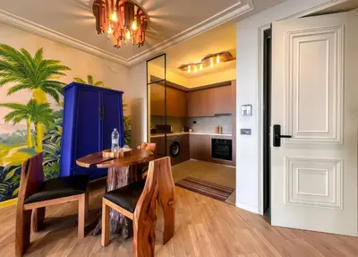 a kitchen and dining room with a table and chairs at Maya Suites - Premium Luxury Stay in Casablanca