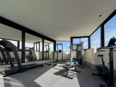 a gym with treadmills and machines in a building at Maya Suites - Premium Luxury Stay in Casablanca