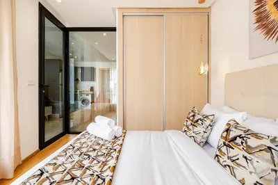 a bedroom with a bed and a sliding glass door at 1- Bourgogne City Escape in Casablanca