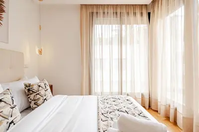 a bedroom with a bed and a large window at 1- Bourgogne City Escape in Casablanca