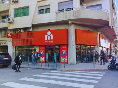 a store on a street with people walking in front of it at A Cozy escape in Morocco in Casablanca