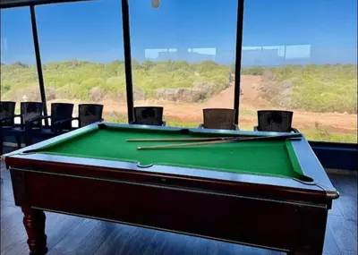 a pool table with chopsticks on top of it at Blue Beach in Sidi Rahal