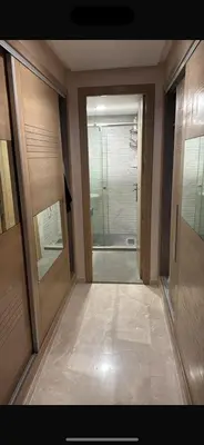 a hallway with two doors and a walk in shower at CityCore duplex in Casablanca