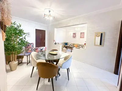 a dining room with a table and chairs at Horizon bleu in Rabat