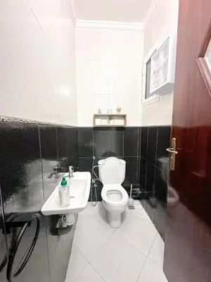 a bathroom with a toilet and a sink at Horizon bleu in Rabat