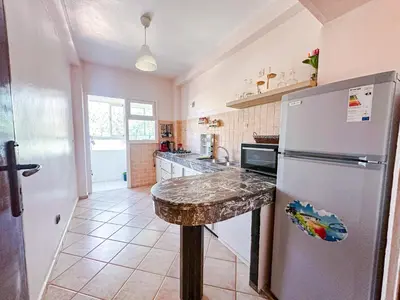 a kitchen with a marble counter top and a refrigerator at Horizon bleu in Rabat