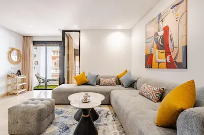 a living room with a couch and a table at 2 - Bourgogne City Escape in Casablanca