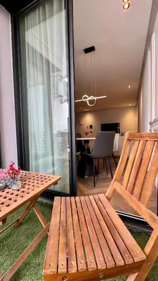 a living room with a wooden bench and a table at Urban Apartment 2 Mars - By AppartAli in Casablanca