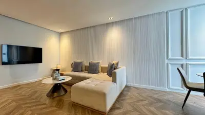 a living room with a couch and a table at Urban Apartment 2 Mars - By AppartAli in Casablanca