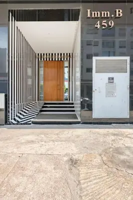 a building with a door and stairs in front of it at Appartement neuf et moderne à l'Agdal, 2 chambres in Rabat