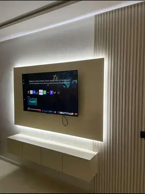 a flat screen tv mounted on a wall at Résidence Beach Land El Mansouria in Mohammedia