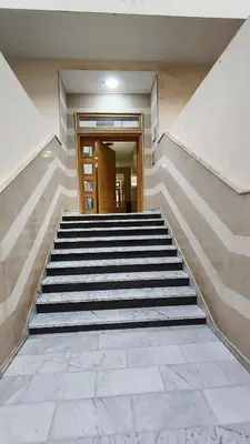 a set of stairs leading to a building at Bel appartement in Casablanca