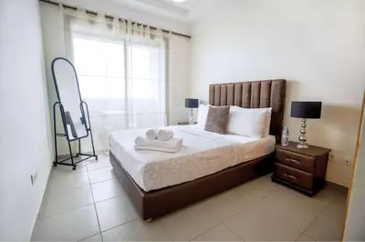 a bedroom with a bed with two towels on it at Comfortable Getaway Near the Beach in Dar Bouazza