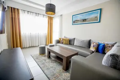 a living room with a couch and a coffee table at Comfortable Getaway Near the Beach in Dar Bouazza