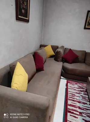a couch with pillows on it in a living room at اقامة فال دانفا in Casablanca