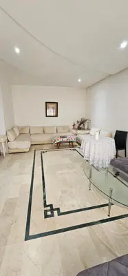 a large living room with couches and a table at اقامة فال دانفا in Casablanca