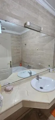 a bathroom with a sink and a mirror at اقامة فال دانفا in Casablanca