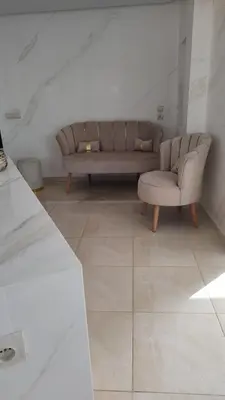 a living room with a couch and a chair at Spacious Apartment with Panoramic Ocean Views in Casablanca