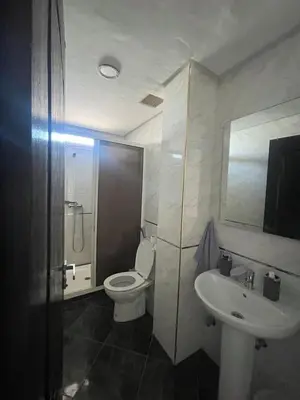 a bathroom with a toilet and a sink at Spacious Apartment with Panoramic Ocean Views in Casablanca