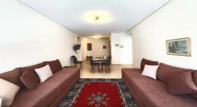 a living room with a couch and a table at Serenity in Rabat's downtown in Rabat